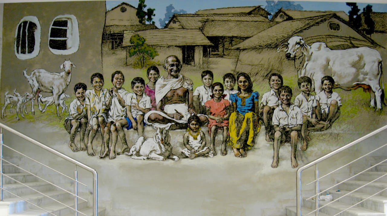 STORY TELLING GANDHI AND CHILDREN </br>Acrylic on wall </br>168” x 480”  </br>At Gandhidham Museum Jalgaon Jain Hills